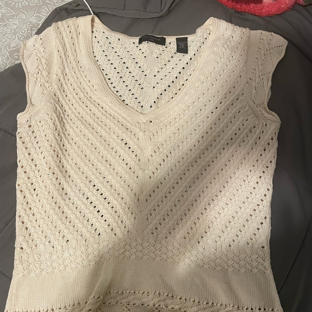 A crocheted white top